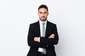 Young business man over isolated background keeping arms crossed