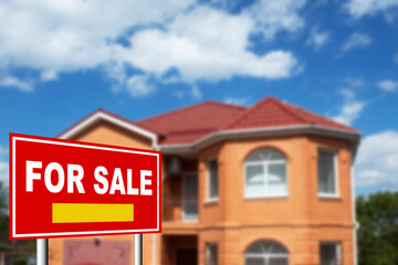 Home for sale. Sign in front of new home