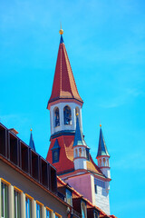 rooftop of Roman Catholic church with bell tower