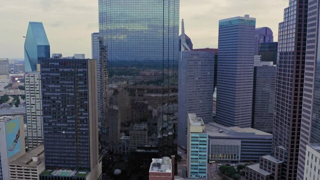 Aerial flying over buildings in downtown Dallas at sunrise, Texas, USA