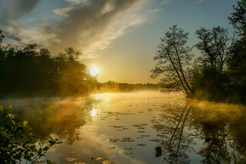 morning mist over the lake during sunrise