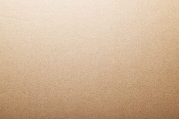 Beige recycled craft paper texture as a background. Brown paper texture, old paper grunge background, vintage page or grunge vignette wrapping. Empty background.