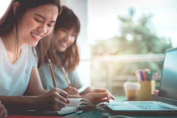 Obraz premium Teenage students are using computers for education via the Internet, Communication system education happy.