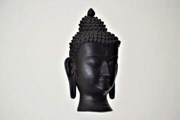 statue of buddha isolated on black side pose 