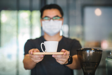 new normal,Coffee shop owner wearing face mask protective for spreading of disease Coronavirus 
