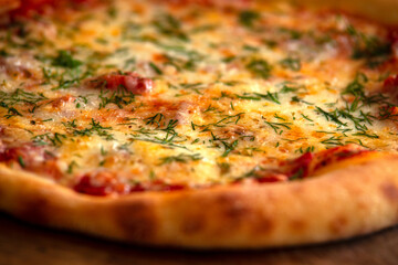 Homemade rustic pizza with ham, cheese and dill