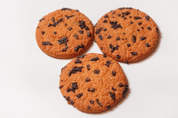 Three Americano cookies with chocolate chips isolated on white background