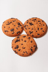 Three Americano cookies with chocolate chips isolated on white background