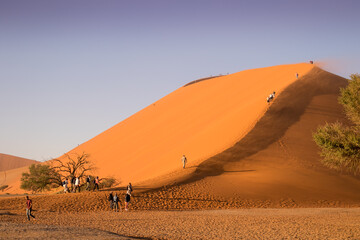 Huge sand dune with tourists