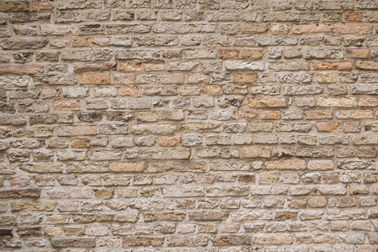 Beige old brick wall background grunge texture