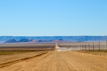 Dusty dirt road in desert