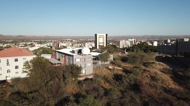 4K aerial drone video savanna hills, Windhoek meteorological service, Windhoek high school sport grounds in city center in Namibia's capital in central highland of Namibia, southern Africa