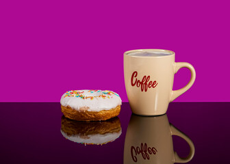 Tasty donut and white cup of coffee with coffee on a pink background with reflection