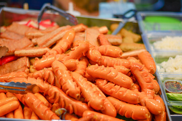 Fried Sausage in a street stall, Traditional fried sausages being cooked, Street food, Street market in thailand, Fried Pork Sausage