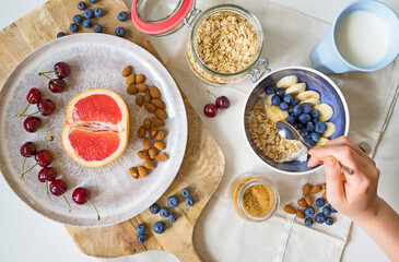 Healthy breakfast with berries, yogurt and oat flakes.