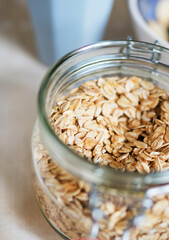 Oat flakes in the glass jar. Close-up view.