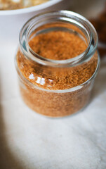 Brown sugar in the glass jar. Close-up view.