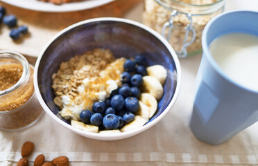 Healthy breakfast with berries, yogurt and oat flakes.