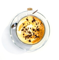 Close-up of coffee foam isolated over a white background, viewed from top.