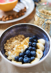 Healthy breakfast with berries, yogurt and oat flakes.
