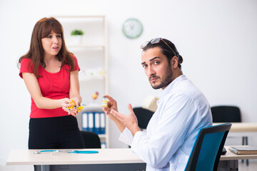 Female diabetic patient visiting young male doctor