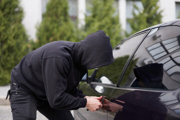 Car thief steal car breaking door criminal job burglar Hijacks  Auto thief black balaclava hoodie...