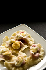 Plate of Polish strawberry dumplings in the kitchen.