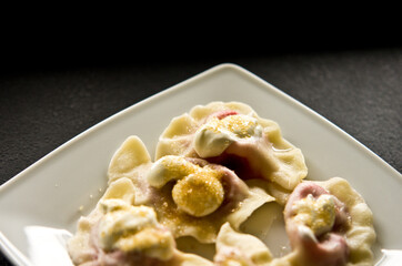 Plate of Polish strawberry dumplings in the kitchen.
