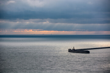 Fototapeta na wymiar sunset on the sea breakwater