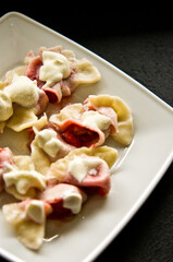 Plate of Polish strawberry dumplings in the kitchen.