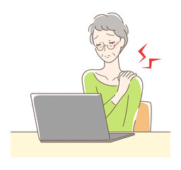 パソコンの前で肩が凝る女性