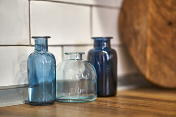 Kitchen decor. Wooden cutting Board and blue vases. Vessels. The dishes in the kitchen. Home accessories.