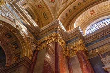Budapest, Hungary - Feb 8, 2020: Luxary gilded ornamentation on column in St. Stephen's Basilica