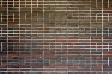 The texture of the old tile on the facade. Geometric background. The architecture of constructivism. Faded decor.