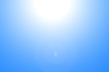 Lens flares from the sun on blue clear sky, nature background