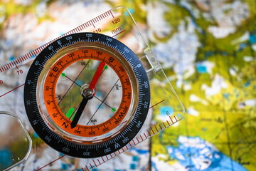 Naklejka premium Orientation by map and compass.