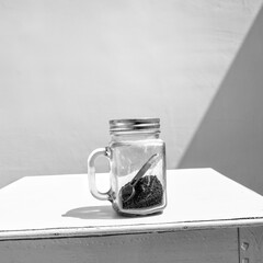 Jar of coffee on wooden table