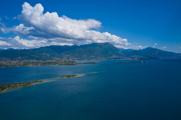 Lake Garda, Italy. Panoramic aerial view of garda island, san biagio island in the background alpine mountains