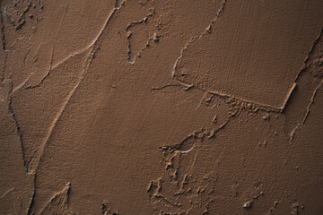 Texture concrete wall  background .Wall fragment with scratches and cracks.