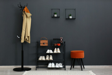Hallway interior with stylish furniture, clothes and accessories