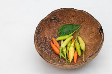 Green and red chilies with white background. Chillies, ingridient of Thai or asian food.
