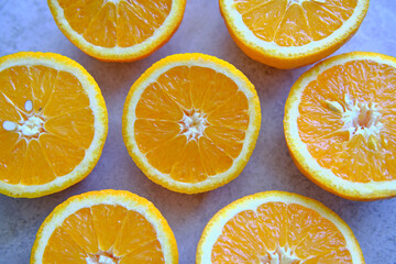 Orange Slices, half cut oranges on a marble background