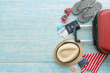 packing a luggage on the blue table for a new journey and travel for a long weekend, tourist...