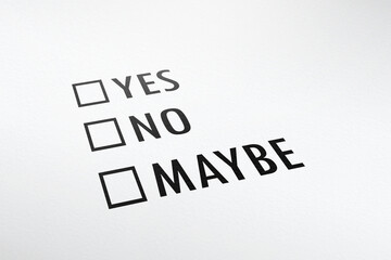Questionnaire with three multiple choices: Yes No Maybe on white paper sheet. Checkbox form test.