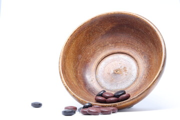 Ayurveda Medicine In Brown Wooden Bowl
