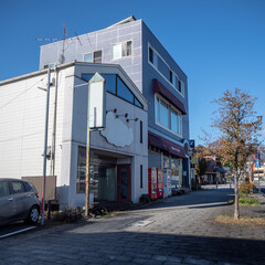 Small building beside empty walkway at midtown of Nikko on clear blue sky background with copy space , Japan