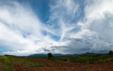 Fototapeta premium Beautiful sun sky cloud at the mountain range and the in the backgroun