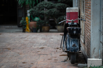 Vintage motorcycle parked beside the building