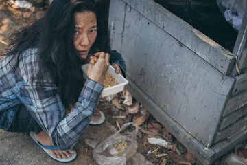 poor people,homeless or beggar begging for help sitting at dirty slum.concept for poverty...