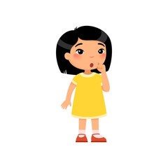 Little asian girl showing silence gesture flat vector illustration. Child in dress standing, thinking cartoon character. Kid with confused face expression considering. Quiet sign